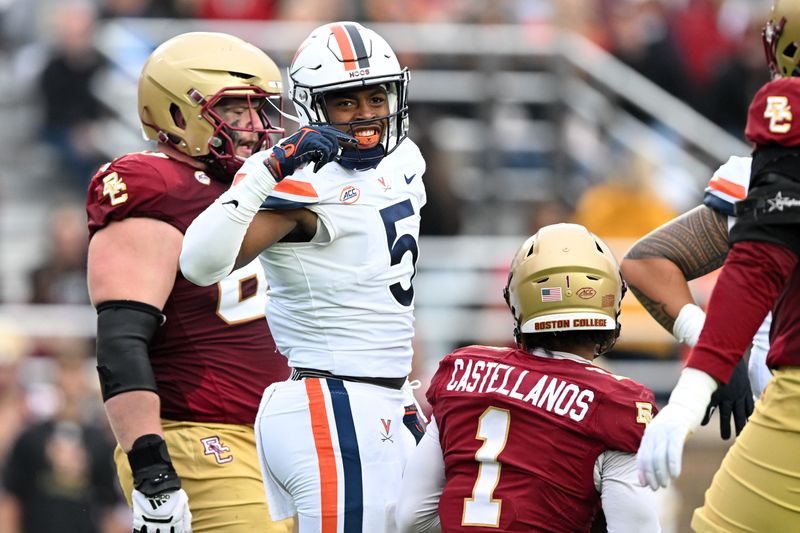 Sep 30, 2023; Chestnut Hill, Massachusetts, USA; Virginia Cavaliers linebacker Kamren Robinson (5) reacts after tackling Boston College Eagles quarterback Thomas Castellanos (1) during the first half at Alumni Stadium. Mandatory Credit: Brian Fluharty-USA TODAY Sports