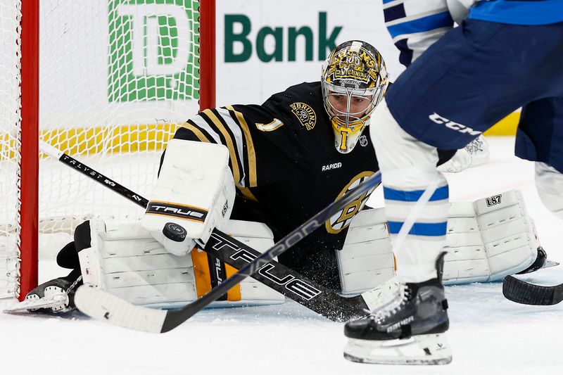 Jan 22, 2024; Boston, Massachusetts, USA; Boston Bruins goaltender Jeremy Swayman (1) makes a save against the Winnipeg Jets during the third period at TD Garden. Mandatory Credit: Winslow Townson-USA TODAY Sports