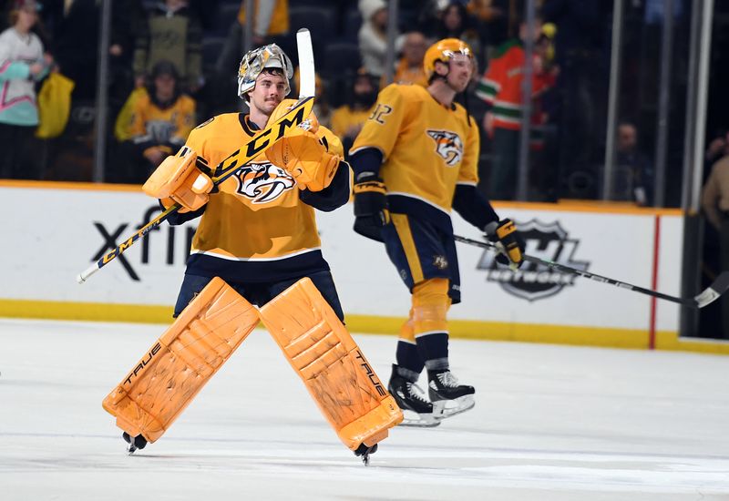 Jan 26, 2023; Nashville, Tennessee, USA; Nashville Predators goaltender Juuse Saros (74) celebrates after a win against the New Jersey Devils at Bridgestone Arena. Mandatory Credit: Christopher Hanewinckel-USA TODAY Sports