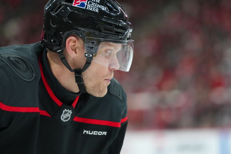 Oct 9, 2025; Raleigh, North Carolina, USA;  Carolina Hurricanes left wing Nikolaj Ehlers (27) looks on against the New Jersey Devils during the third period at Lenovo Center. Mandatory Credit: James Guillory-Imagn Images