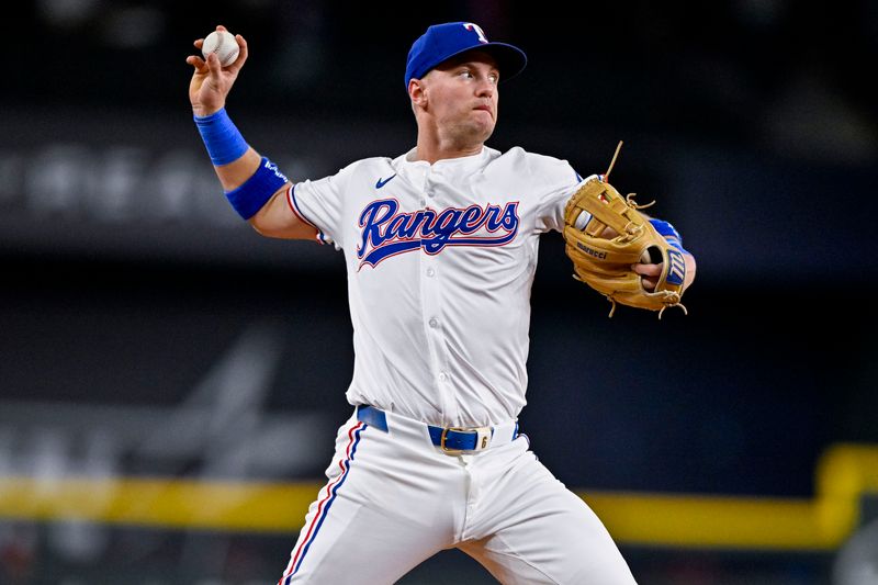 Sep 5, 2024; Arlington, Texas, USA; Texas Rangers third baseman Josh Jung (6) throws out Los Angeles Angels center fielder Kevin Pillar (not pictured) at first base during the first inning at Globe Life Field. Mandatory Credit: Jerome Miron-Imagn Images