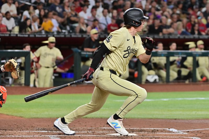 Jun 4, 2024; Phoenix, Arizona, USA;  Arizona Diamondbacks outfielder Jake McCarthy (31) singles in the third inning against the San Francisco Giants at Chase Field. Mandatory Credit: Matt Kartozian-USA TODAY Sports