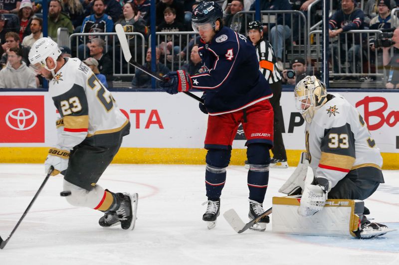 Mar 4, 2024; Columbus, Ohio, USA; Vegas Golden Knights defenseman Alec Martinez (23) blocks a Columbus Blue Jackets shot attempt during the second period at Nationwide Arena. Mandatory Credit: Russell LaBounty-USA TODAY Sports