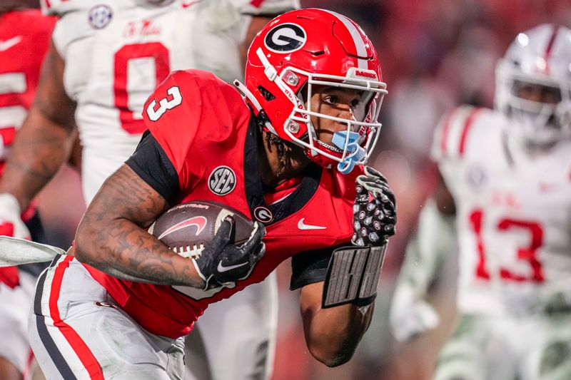 Nov 11, 2023; Athens, Georgia, USA; A Georgia Bulldogs running back Andrew Paul (3) runs for a touchdown against the Mississippi Rebels during the second half at Sanford Stadium. Mandatory Credit: Dale Zanine-USA TODAY Sports