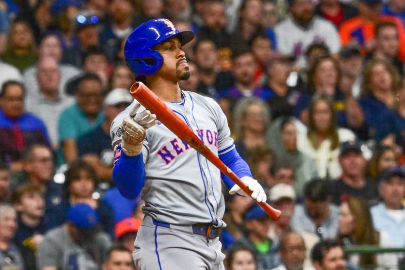 Sep 28, 2024; Milwaukee, Wisconsin, USA; New York Mets designated hitter Francisco Lindor (12) reacts after striking out in the sixth inning against the Milwaukee Brewers at American Family Field. Mandatory Credit: Benny Sieu-Imagn Images