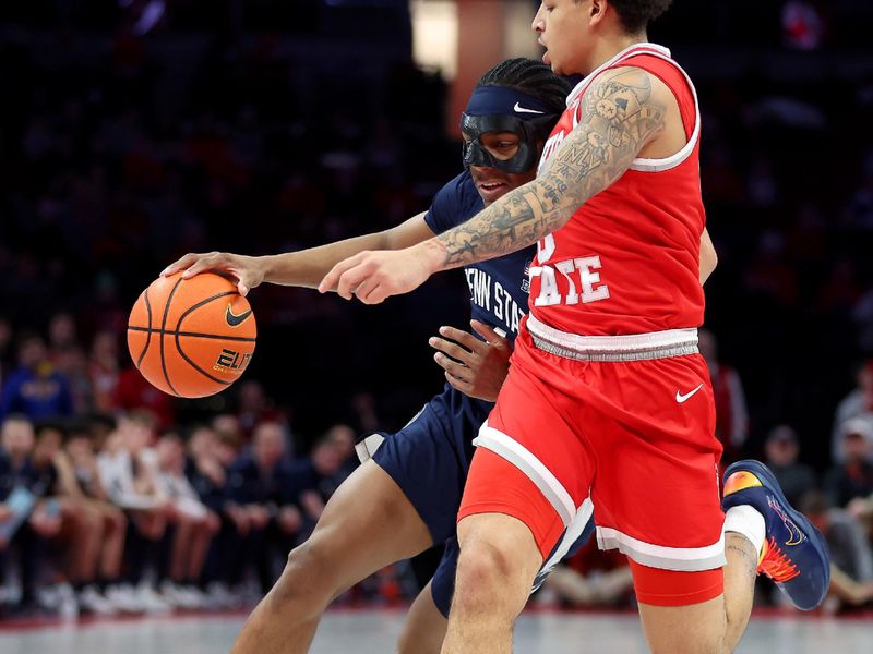 Jan 26, 2026; Columbus, Ohio, USA; Penn State Nittany Lions guard Kayden Mingo (4) brings the ball up court as Ohio State Buckeyes guard John Mobley Jr. (0) defends during the first half at Value City Arena. Mandatory Credit: Joseph Maiorana-Imagn Images
