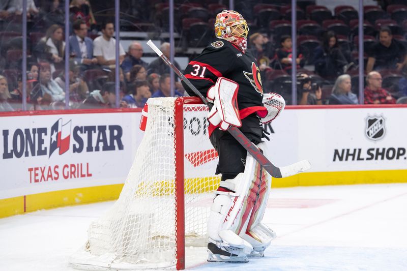 Sep 24, 2024; Ottawa, Ontario, CAN; Ottawa Senators goalie Anton Forsberg (31) follows the action up the ice in the second period against the  Toronto Maple Leafs at the Canadian Tire Centre. Mandatory Credit: Marc DesRosiers-Imagn Images