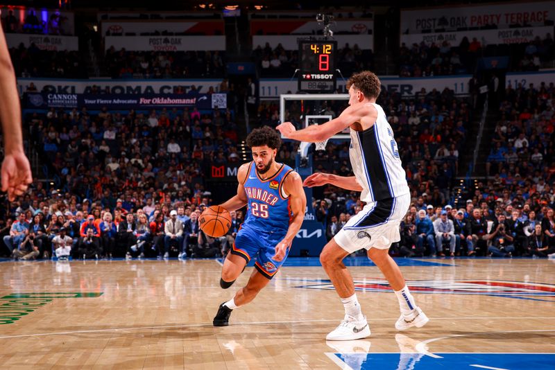 OKLAHOMA CITY, OK - NOVEMBER 4:  Ajay Mitchell #25 of the Oklahoma City Thunder dribbles the ball during the game against the Orlando Magic on November 4, 2024 at Paycom Center in Oklahoma City, Oklahoma. NOTE TO USER: User expressly acknowledges and agrees that, by downloading and or using this photograph, User is consenting to the terms and conditions of the Getty Images License Agreement. Mandatory Copyright Notice: Copyright 2024 NBAE (Photo by Zach Beeker/NBAE via Getty Images)