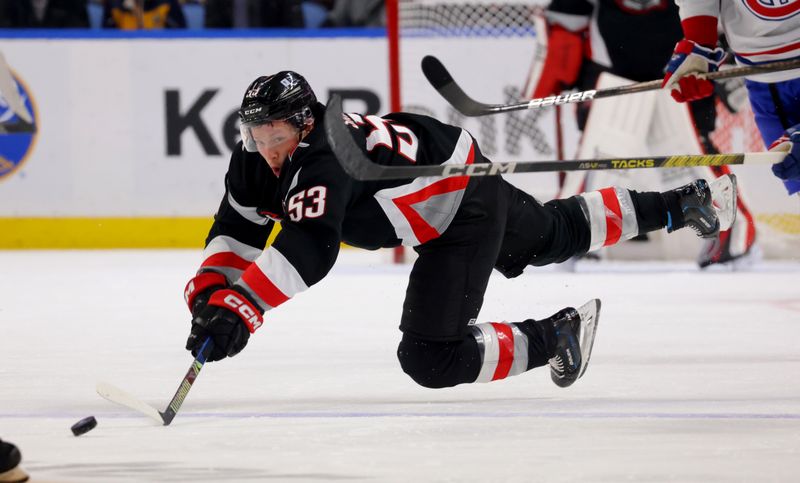 Dec 9, 2023; Buffalo, New York, USA;  Buffalo Sabres left wing Jeff Skinner (53) dives to make a pass during the second period against the Montreal Canadiens at KeyBank Center. Mandatory Credit: Timothy T. Ludwig-USA TODAY Sports