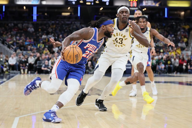 INDIANAPOLIS, INDIANA - JANUARY 25: Patrick Beverley #22 of the Philadelphia 76ers dribbles the ball in the first half while defended by Pascal Siakam #43 of the Indiana Pacers at Gainbridge Fieldhouse on January 25, 2024 in Indianapolis, Indiana.    NOTE TO USER: User expressly acknowledges and agrees that, by downloading and or using this photograph, User is consenting to the terms and conditions of the Getty Images License Agreement.  (Photo by Andy Lyons/Getty Images)