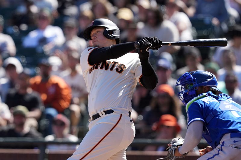 Apr 9, 2023; San Francisco, California, USA; San Francisco Giants first baseman Wilmer Flores (41) hits an RBI double against the Kansas City Royals during the eighth inning at Oracle Park. Mandatory Credit: Darren Yamashita-USA TODAY Sports