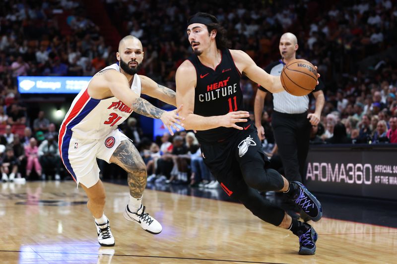 MIAMI, FLORIDA - MARCH 05: Jaime Jaquez Jr. #11 of the Miami Heat drives against Evan Fournier #31 of the Detroit Pistons during the first quarter of the game at Kaseya Center on March 05, 2024 in Miami, Florida. NOTE TO USER: User expressly acknowledges and agrees that, by downloading and or using this photograph, User is consenting to the terms and conditions of the Getty Images License Agreement. (Photo by Megan Briggs/Getty Images)