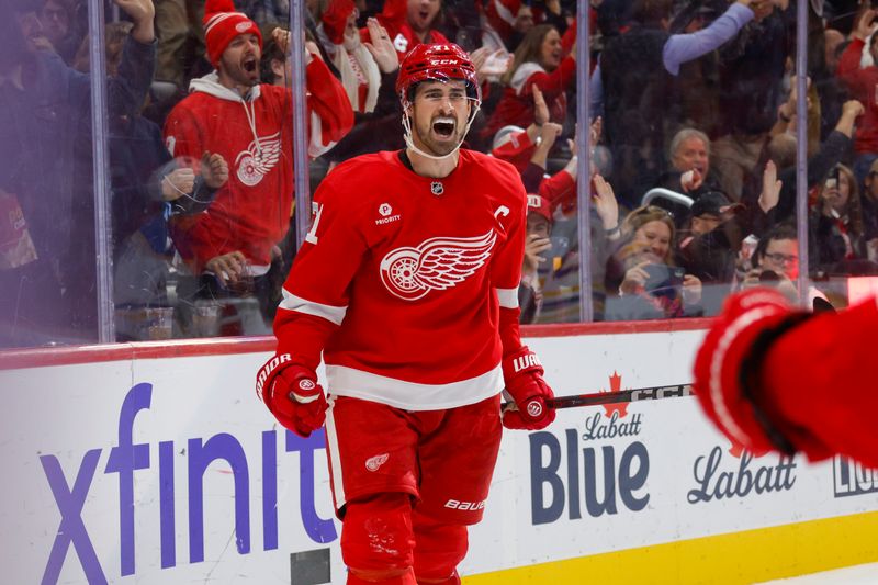 Nov 2, 2024; Detroit, Michigan, USA; Detroit Red Wings center Dylan Larkin (71) celebrates a goal in the second period of the game against the Buffalo Sabres at Little Caesars Arena. Mandatory Credit: Brian Bradshaw Sevald-Imagn Images