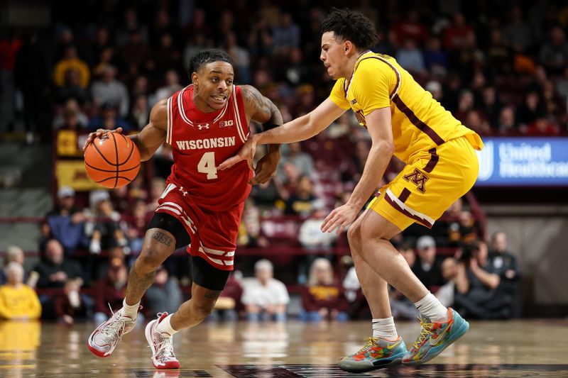 Mar 5, 2025; Minneapolis, Minnesota, USA; Wisconsin Badgers guard Kamari McGee (4) works around Minnesota Golden Gophers guard Mike Mitchell Jr. (2) during the second half at Williams Arena. Mandatory Credit: Matt Krohn-Imagn Images