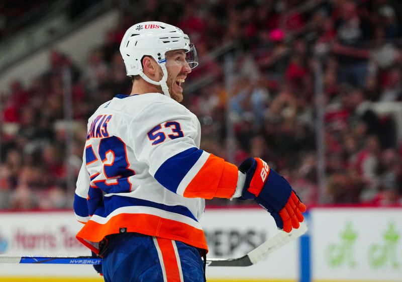 Apr 30, 2024; Raleigh, North Carolina, USA; New York Islanders center Casey Cizikas (53) celebrates his goal against the Carolina Hurricanes during the second period in game five of the first round of the 2024 Stanley Cup Playoffs at PNC Arena. Mandatory Credit: James Guillory-USA TODAY Sports