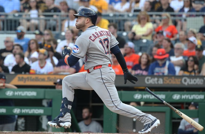 Jun 4, 2025; Pittsburgh, Pennsylvania, USA;  Houston Astros catcher Victor Caratini (17) hits a double against the Pittsburgh Pirates during the second inning at PNC Park. Mandatory Credit: Charles LeClaire-Imagn Images