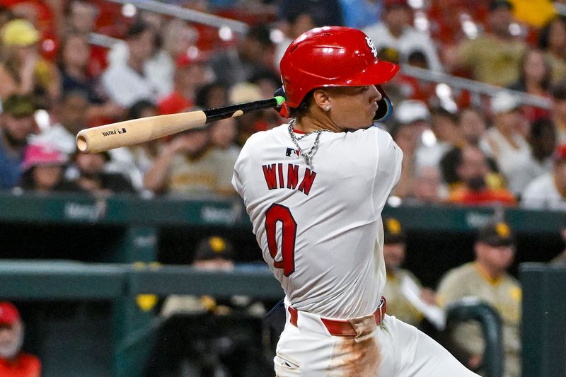 Aug 28, 2024; St. Louis, Missouri, USA;  St. Louis Cardinals shortstop Masyn Winn (0) hits a single against the San Diego Padres during the ninth inning at Busch Stadium. Mandatory Credit: Jeff Curry-USA TODAY Sports