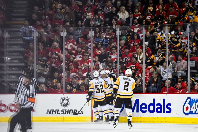 Mar 2, 2024; Calgary, Alberta, CAN; Pittsburgh Penguins center Jonathan Gruden (44) celebrates a goal against the Calgary Flames with teammates during the first period at Scotiabank Saddledome. Mandatory Credit: Brett Holmes-USA TODAY Sports