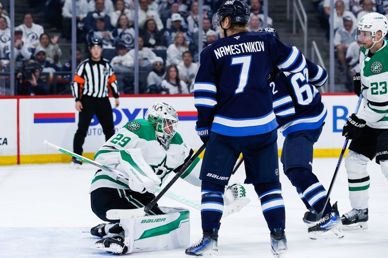 May 7, 2025; Winnipeg, Manitoba, CAN; Dallas Stars goalie Jake Oettinger (29) makes a save as Winnipeg Jets forward Vladislav Namestnikov (7) looks for a rebound during the second period in game one of the second round of the 2025 Stanley Cup Playoffs at Canada Life Centre. Mandatory Credit: Terrence Lee-Imagn Images