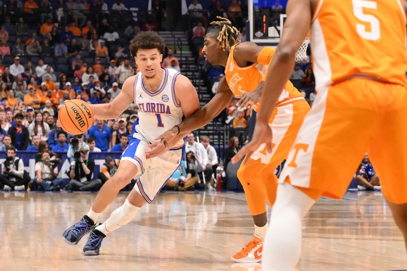 Mar 16, 2025; Nashville, TN, USA; Florida Gators guard Walter Clayton Jr. (1) dribbles the ball against the Tennessee Volunteers in the first half during the 2025 SEC Championship Game at Bridgestone Arena. Mandatory Credit: Steve Roberts-Imagn Images