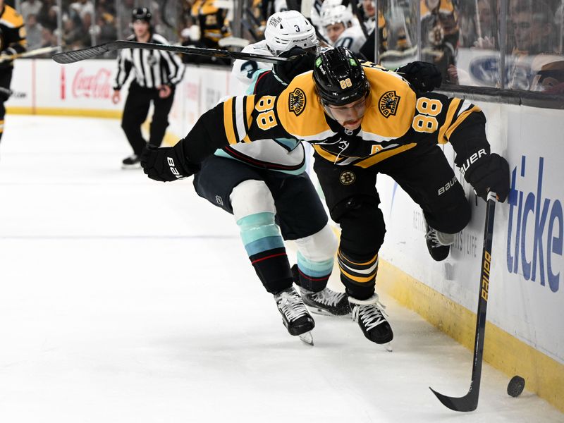 Nov 3, 2024; Boston, Massachusetts, USA; Boston Bruins right wing David Pastrnak (88) controls the puck against Seattle Kraken defenseman Will Borgen (3) during the first period at the TD Garden. Mandatory Credit: Brian Fluharty-Imagn Images