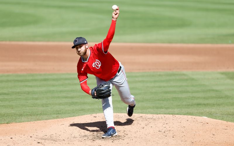 Feb 25, 2025; Jupiter, Florida, USA;  Washington Nationals relief pitcher Colin Poche (41) throws against the Miami Marlins during the fourth inning at Roger Dean Chevrolet Stadium. Mandatory Credit: Rhona Wise-Imagn Image 