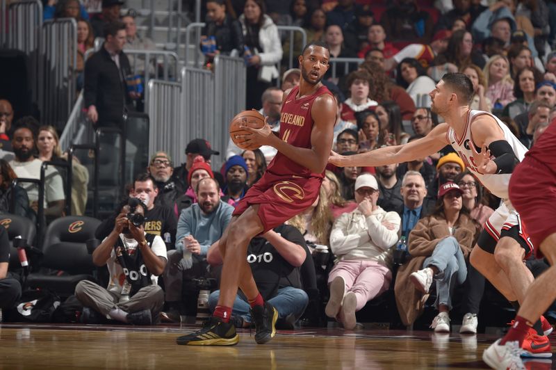 CLEVELAND, OH - FEBRUARY 14: Evan Mobley #4 of the Cleveland Cavaliers handles the ball during the game against the Chicago Bulls on February 14, 2024 at Rocket Mortgage FieldHouse in Cleveland, Ohio. NOTE TO USER: User expressly acknowledges and agrees that, by downloading and/or using this Photograph, user is consenting to the terms and conditions of the Getty Images License Agreement. Mandatory Copyright Notice: Copyright 2024 NBAE (Photo by David Liam Kyle/NBAE via Getty Images)