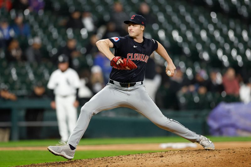 May 9, 2024; Chicago, Illinois, USA; Cleveland Guardians relief pitcher Tim Herrin (29) delivers a pitch against the Chicago White Sox during the eight inning at Guaranteed Rate Field. Mandatory Credit: Kamil Krzaczynski-USA TODAY Sports