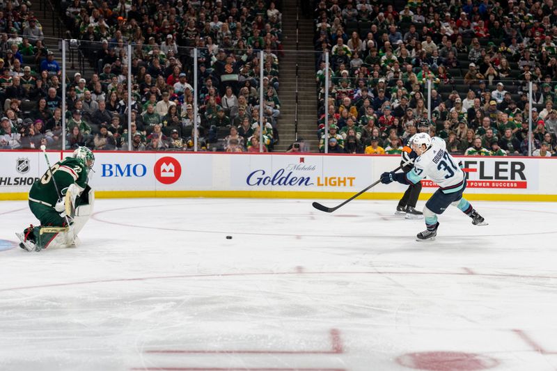 Apr 18, 2024; Saint Paul, Minnesota, USA; Seattle Kraken center Yanni Gourde (37) scores on Minnesota Wild goaltender Marc-Andre Fleury (29) in the third period at Xcel Energy Center. Mandatory Credit: Matt Blewett-USA TODAY Sports