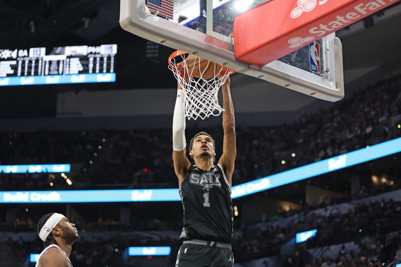 SAN ANTONIO, TX - APRIL 7: (EDITORS NOTE: Sequence 1 of 3) Victor Wembanyama #1 of the San Antonio Spurs dunks the ball during the game against the Philadelphia 76ers on April 7, 2024 at the Frost Bank Center in San Antonio, Texas. NOTE TO USER: User expressly acknowledges and agrees that, by downloading and or using this photograph, user is consenting to the terms and conditions of the Getty Images License Agreement. Mandatory Copyright Notice: Copyright 2024 NBAE (Photos by Tim Heitman/NBAE via Getty Images)