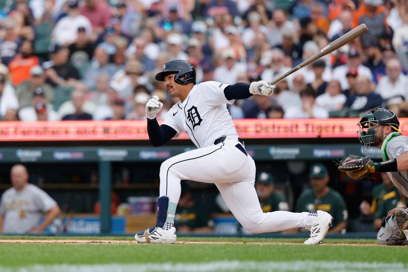 Jun 26, 2025; Detroit, Michigan, USA;  Detroit Tigers designated hitter Jahmai Jones (18) hits a two RBI double in the third inning against the Athletics at Comerica Park. Mandatory Credit: Rick Osentoski-Imagn Images