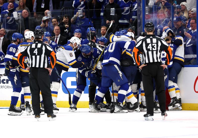 Dec 19, 2023; Tampa, Florida, USA; Tampa Bay Lightning and St. Louis Blues fight during the third period at Amalie Arena. Mandatory Credit: Kim Klement Neitzel-USA TODAY Sports