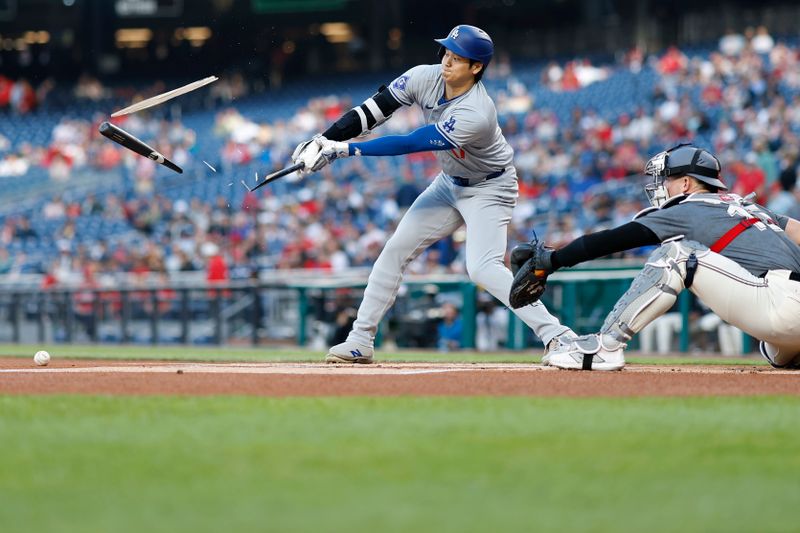 Apr 23, 2024; Washington, District of Columbia, USA; Los Angeles Dodgers designated hitter Shohei Ohtani (17) shatters his bat while hitting a ground ball against the Washington Nationals during the first inning at Nationals Park. Mandatory Credit: Geoff Burke-USA TODAY Sports