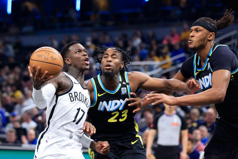 INDIANAPOLIS, INDIANA - MARCH 16: Dennis Schroder #17 of the Brooklyn Nets drives to the basket against Aaron Nesmith #23 and Myles Turner #33 of the Indiana Pacers during the first half at Gainbridge Fieldhouse on March 16, 2024 in Indianapolis, Indiana. NOTE TO USER: User expressly acknowledges and agrees that, by downloading and or using this photograph, User is consenting to the terms and conditions of the Getty Images License Agreement. (Photo by Justin Casterline/Getty Images)