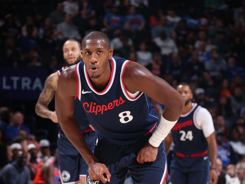 OKLAHOMA CITY, OK - NOVEMBER 11: Kris Dunn #8 of the LA Clippers looks on during the game against the Oklahoma City Thunder on November 11, 2024 at Paycom Center in Oklahoma City, Oklahoma. NOTE TO USER: User expressly acknowledges and agrees that, by downloading and or using this photograph, User is consenting to the terms and conditions of the Getty Images License Agreement. Mandatory Copyright Notice: Copyright 2024 NBAE (Photo by Nathaniel S. Butler/NBAE via Getty Images)