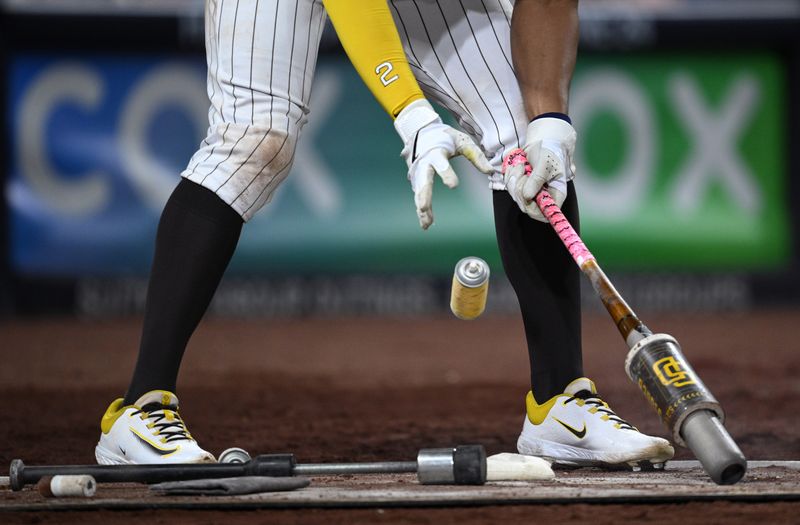 Jun 15, 2023; San Diego, California, USA; San Diego Padres shortstop Xander Bogaerts (2) works on his bat in the on-deck circle during the eighth inning against the Cleveland Guardians at Petco Park. Mandatory Credit: Orlando Ramirez-USA TODAY Sports