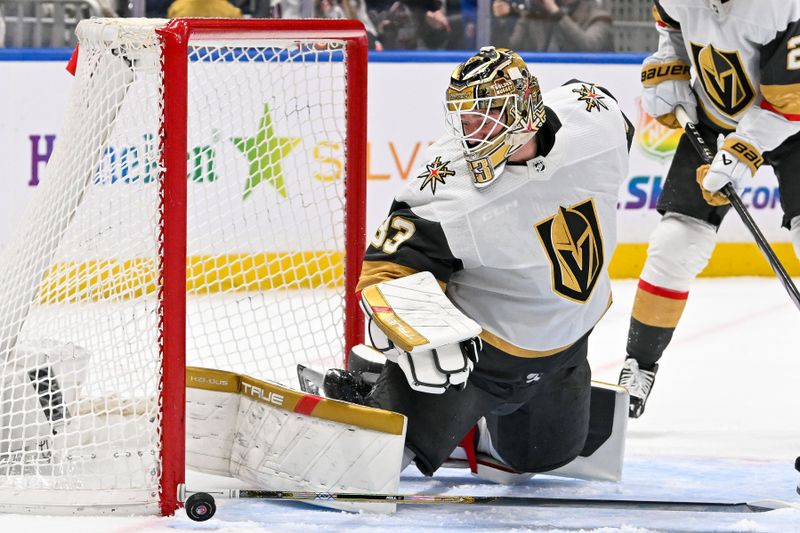 Jan 23, 2024; Elmont, New York, USA;  Vegas Golden Knights goaltender Adin Hill (33) makes a save against the New York Islanders during the second period at UBS Arena. Mandatory Credit: Dennis Schneidler-USA TODAY Sports