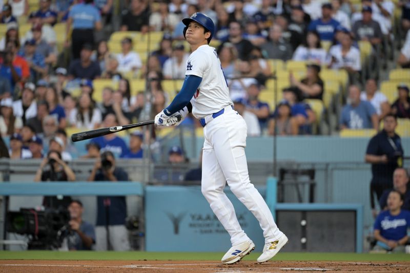 Jul 24, 2024; Los Angeles, California, USA;  Los Angeles Dodgers designated hitter Shohei Ohtani (17) hits a long fly ball for an out in the first inning against the San Francisco Giants at Dodger Stadium. Mandatory Credit: Jayne Kamin-Oncea-USA TODAY Sports