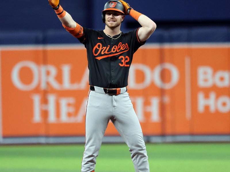 Jun 7, 2024; St. Petersburg, Florida, USA;Baltimore Orioles first base Ryan O'Hearn (32) celebrates after he doubles during the eighth inning against the Tampa Bay Rays  at Tropicana Field. Mandatory Credit: Kim Klement Neitzel-USA TODAY Sports