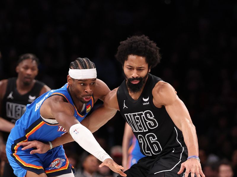 NEW YORK, NEW YORK - JANUARY 05:  Shai Gilgeous-Alexander #2 of the Oklahoma City Thunder and Spencer Dinwiddie #26 of the Brooklyn Nets battle for the ball during their game at Barclays Center on January 05, 2024 in New York City.  User expressly acknowledges and agrees that, by downloading and or using this photograph, User is consenting to the terms and conditions of the Getty Images License Agreement.   (Photo by Al Bello/Getty Images)