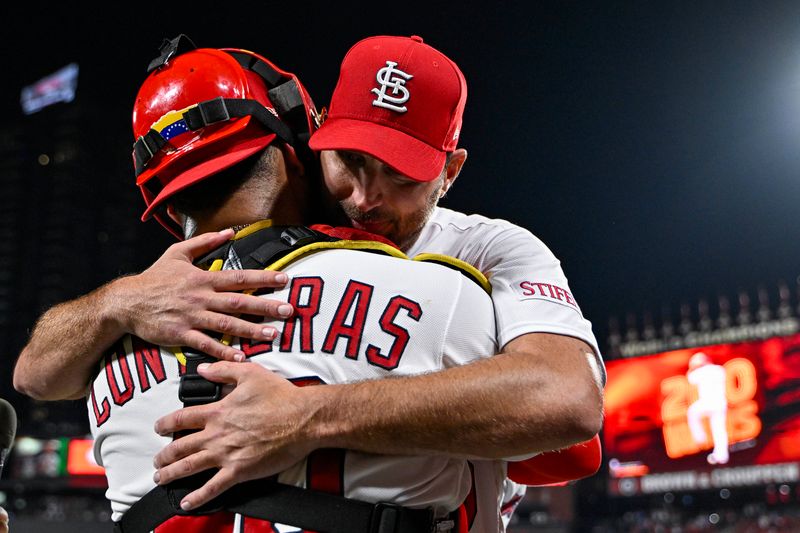 Sep 18, 2023; St. Louis, Missouri, USA;  St. Louis Cardinals starting pitcher Adam Wainwright (50) hugs catcher Willson Contreras (40) after winning his 200th career game in a 1-0 victory over the Milwaukee Brewers at Busch Stadium. Mandatory Credit: Jeff Curry-USA TODAY Sports