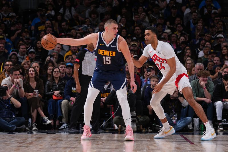 DENVER, CO - MARCH 11: Nikola Jokic #15 of the Denver Nuggets handles the ball during the game against the Toronto Raptors on March 11, 2024 at the Ball Arena in Denver, Colorado. NOTE TO USER: User expressly acknowledges and agrees that, by downloading and/or using this Photograph, user is consenting to the terms and conditions of the Getty Images License Agreement. Mandatory Copyright Notice: Copyright 2024 NBAE (Photo by Bart Young/NBAE via Getty Images)