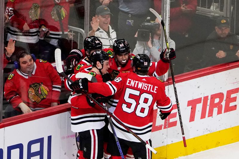 Apr 13, 2023; Chicago, Illinois, USA; Chicago Blackhawks left wing Anders Bjork (24) celebrates his goal against the Philadelphia Flyers during the first period at United Center. Mandatory Credit: David Banks-USA TODAY Sports