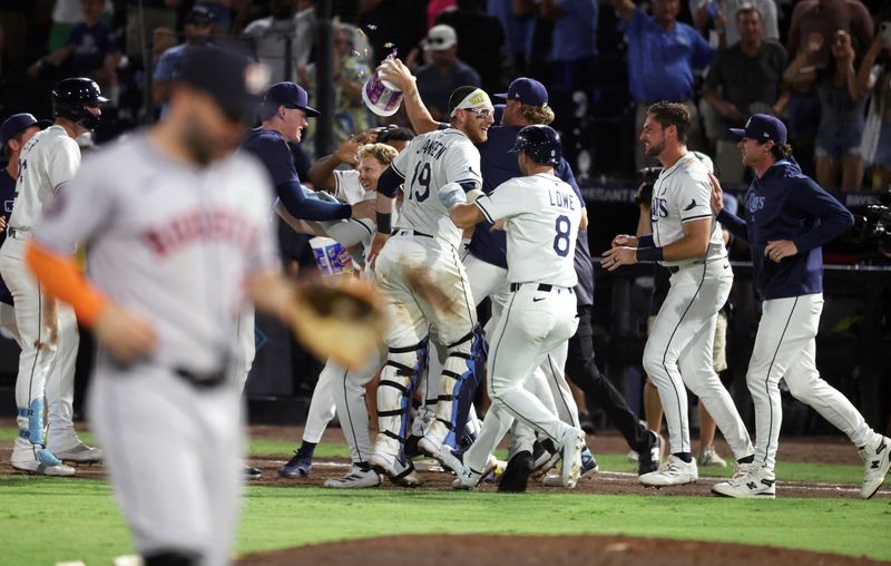 May 20, 2025; St. Petersburg, Florida, USA; Tampa Bay Rays shortstop Taylor Walls (6) is congratulated by teammates after he hit a walk-off RBI sacrifice fly to beat the Houston Astros at George M. Steinbrenner Field. Mandatory Credit: Kim Klement Neitzel-Imagn Images