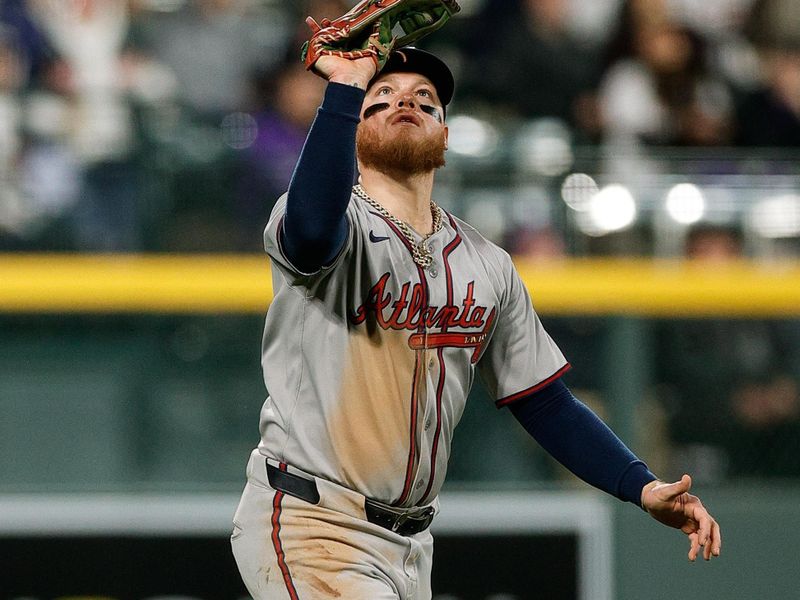 Apr 28, 2025; Denver, Colorado, USA; Atlanta Braves left fielder Alex Verdugo (8) makes a catch in the fifth inning against the Colorado Rockies at Coors Field. Mandatory Credit: Isaiah J. Downing-Imagn Images