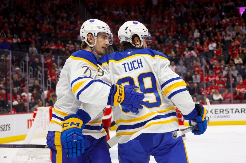 Nov 2, 2024; Detroit, Michigan, USA; Buffalo Sabres right wing Alex Tuch (89) celebrates a goal in the first period of the game against the Detroit Red Wings with Buffalo Sabres center Ryan McLeod (71) at Little Caesars Arena. Mandatory Credit: Brian Bradshaw Sevald-Imagn Images