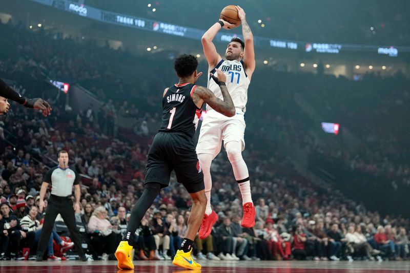 PORTLAND, OREGON - DECEMBER 01: Luka Doncic #77 of the Dallas Mavericks shoots the ball over Anfernee Simons #1 of the Portland Trail Blazers during the first half at Moda Center on December 01, 2024 in Portland, Oregon. NOTE TO USER: User expressly acknowledges and agrees that, by downloading and or using this photograph, User is consenting to the terms and conditions of the Getty Images License Agreement. (Photo by Soobum Im/Getty Images)