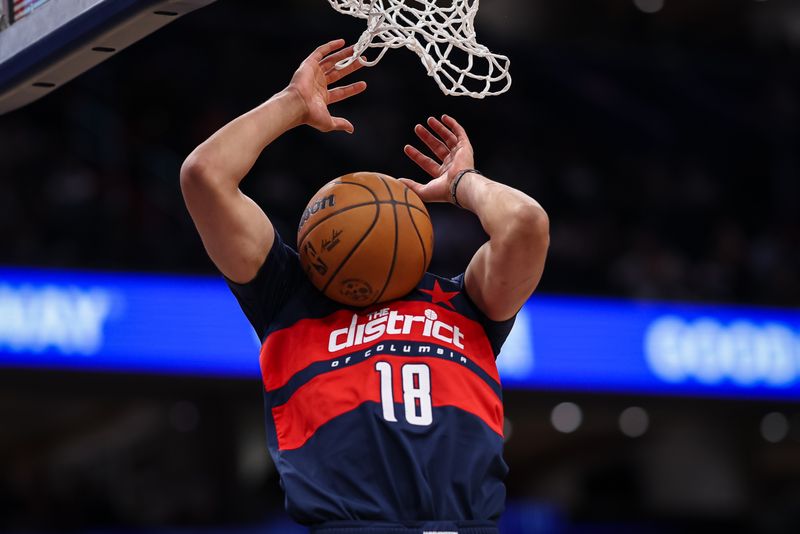 WASHINGTON, DC - NOVEMBER 04: Kyshawn George #18 of the Washington Wizards goes to the basket against the Golden State Warriors during the second half at Capital One Arena on November 04, 2024 in Washington, DC. NOTE TO USER: User expressly acknowledges and agrees that, by downloading and or using this photograph, User is consenting to the terms and conditions of the Getty Images License Agreement. (Photo by Scott Taetsch/Getty Images)