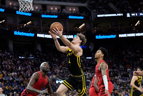 SAN FRANCISCO, CALIFORNIA - DECEMBER 23: Brandin Podziemski #2 of the Golden State Warriors shoots against the Portland Trail Blazers during the second half of an NBA basketball game at Chase Center on December 23, 2023 in San Francisco, California. NOTE TO USER: User expressly acknowledges and agrees that, by downloading and or using this photograph, User is consenting to the terms and conditions of the Getty Images License Agreement. (Photo by Thearon W. Henderson/Getty Images)