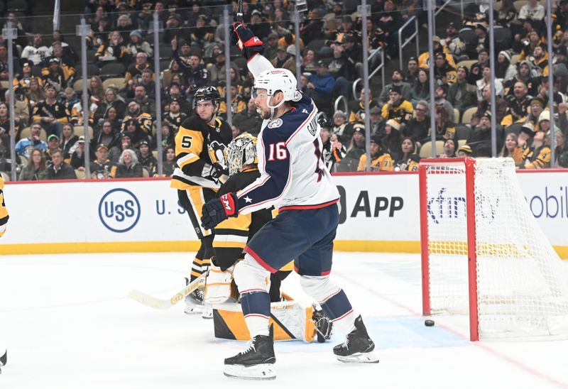 Jan 17, 2026; Pittsburgh, Pennsylvania, USA;  Columbus Blue Jackets center Adam Fantilli (16) celebrates a goal by  left wing Danton Heinen (43) on Pittsburgh Penguins goalie Arturs Silovs (37) as center looks on during the second period at PPG Paints Arena. Mandatory Credit: Philip G. Pavely-Imagn Images